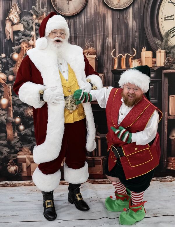 Santa Ray with his elf helper in a toy-workshop set