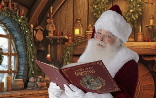 Santa Ray reading a large storybook in a cosy cabin